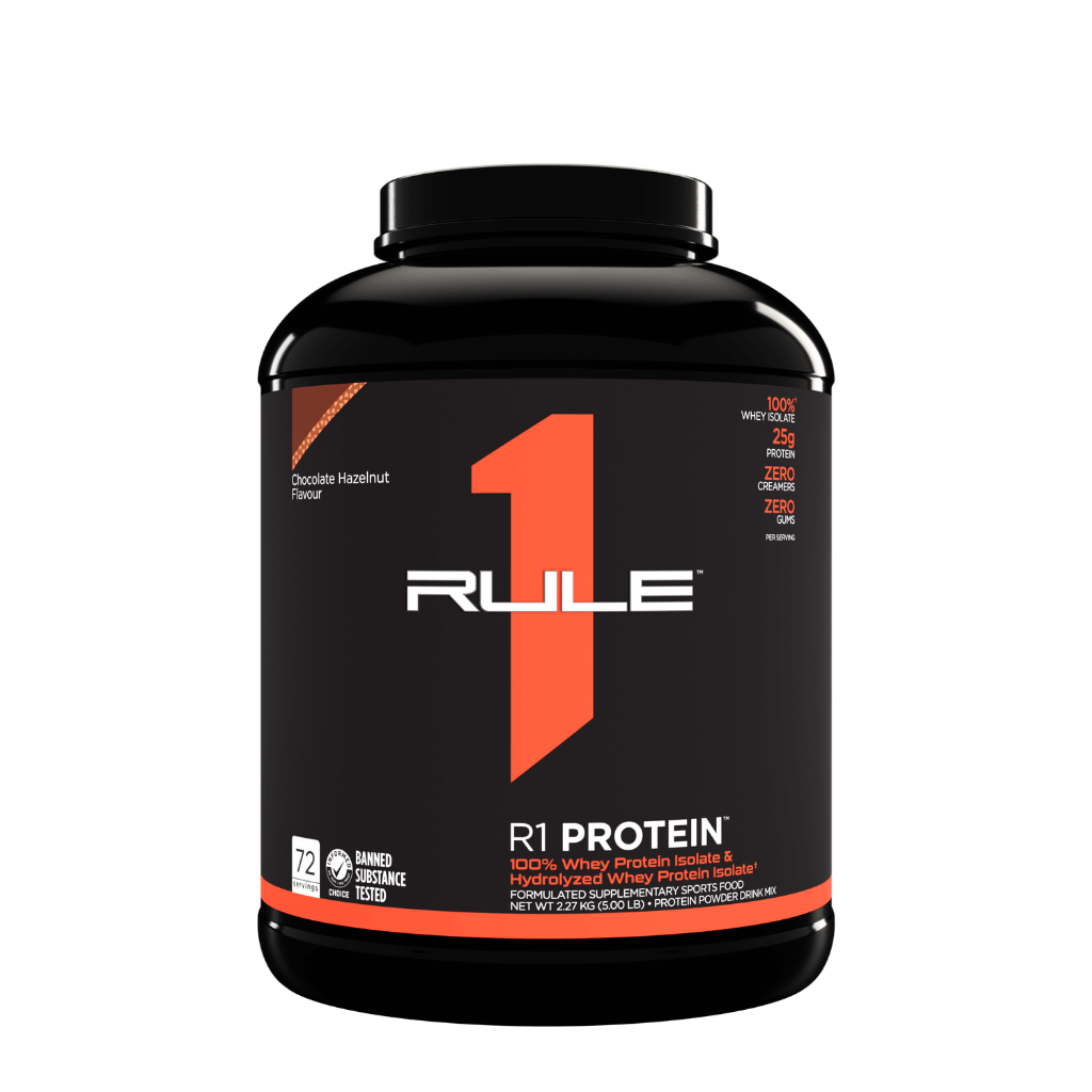 Black tub of Rule 1 R1 Protein whey protein powder with orange logo on a black label and the words R1 PROTEINth.